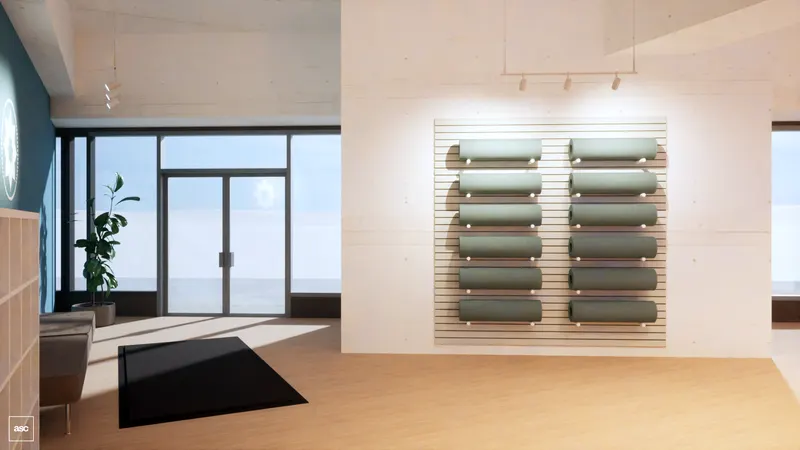 Midtown studio — rolled mats on a timber rack beside a bench and glazed entrance doors.
