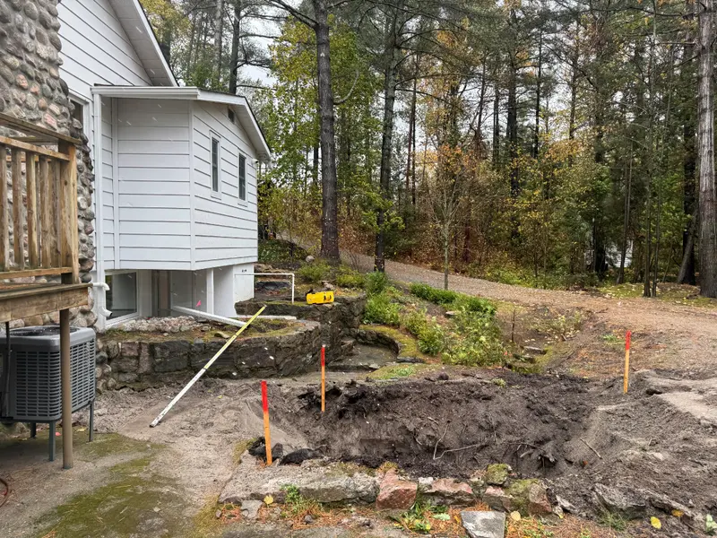 Groundworks beside the existing cottage.