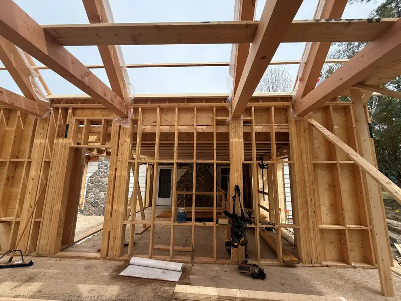 Timber walls and exposed roof framing of the addition.