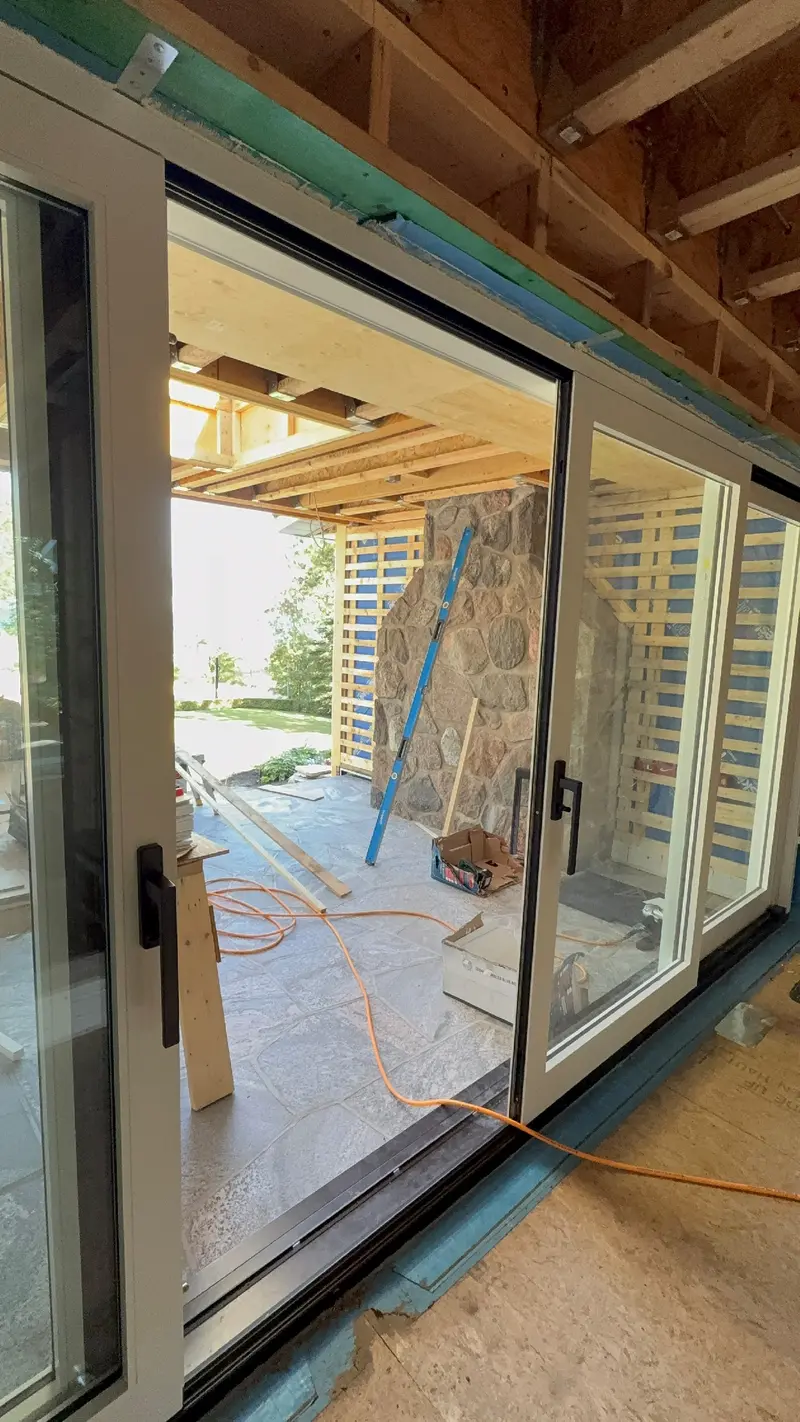 Glazed doors between the interior and the covered porch.