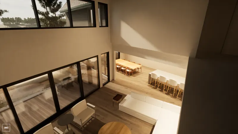 View from the upper landing into the double-height living and dining room.