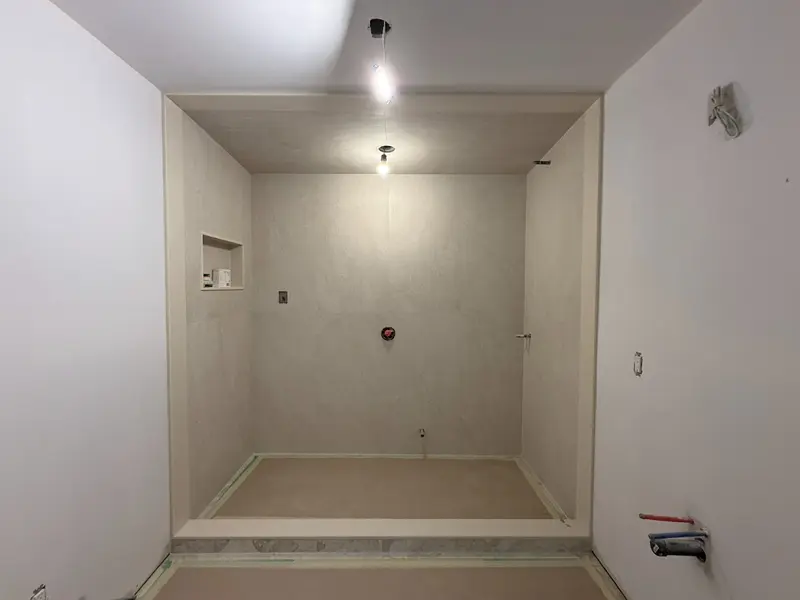 Shower walls and floor before fittings are installed.