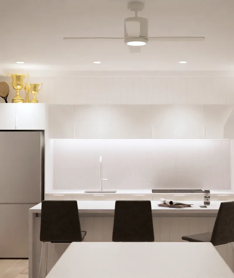 Front view of the clubhouse kitchen with white cabinetry and an island.