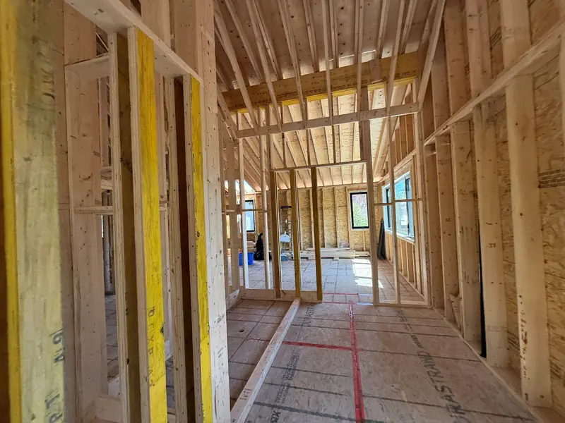 Timber partitions and roof framing in the upper floor.