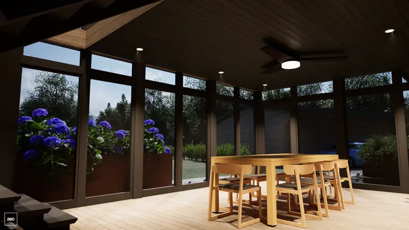 Timber dining table in a screened porch beside planters of blue hydrangeas.