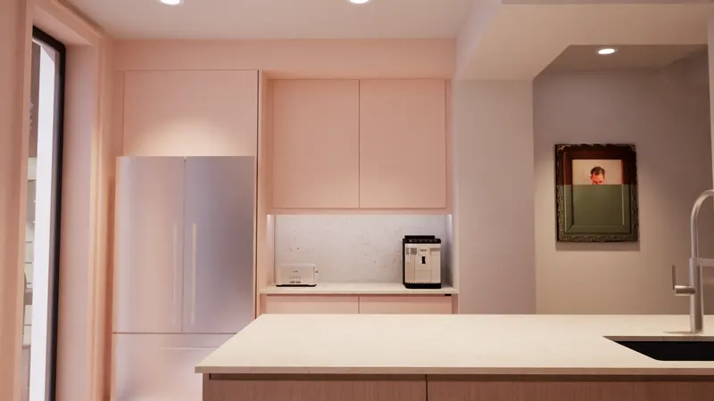 Pale cabinetry around a refrigerator and small counter beside a pale-topped island.