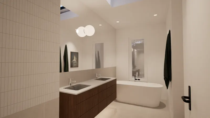 Timber vanity and freestanding bath against pale tiled walls.