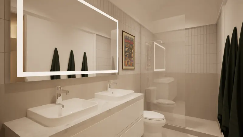 Double basin and illuminated rectangular mirror in a compact tiled bathroom.