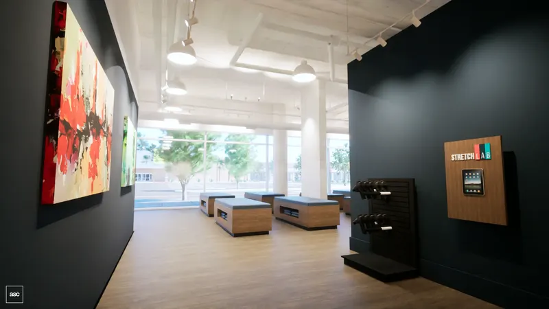 West studio — tool rack and tablet kiosk in a dark partition beside the open treatment floor.