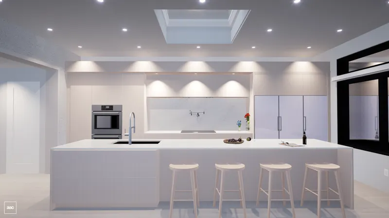 White kitchen island and pale cabinetry viewed through a broad opening.
