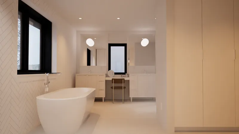 Freestanding bath beside a double vanity and white herringbone tile.